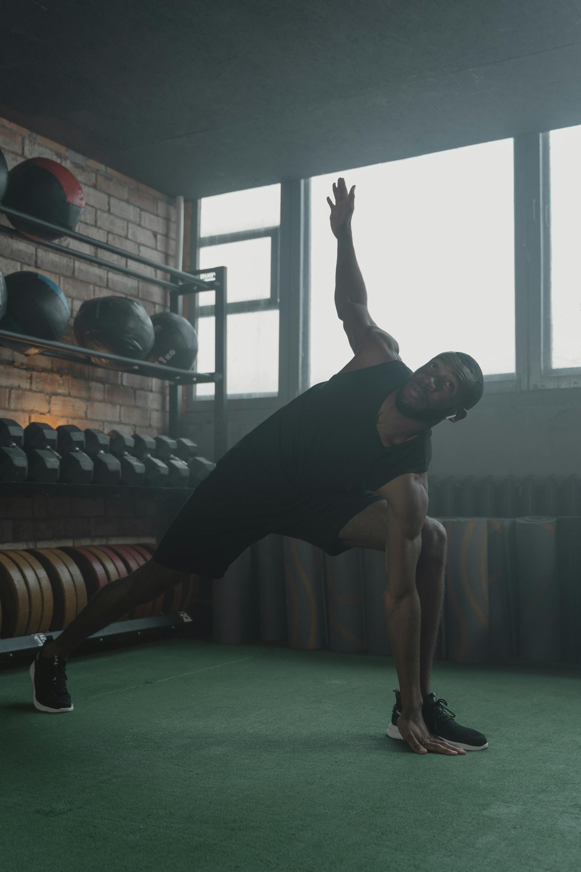 Fit athletic man exercising in the gym - best supplements for men over 30