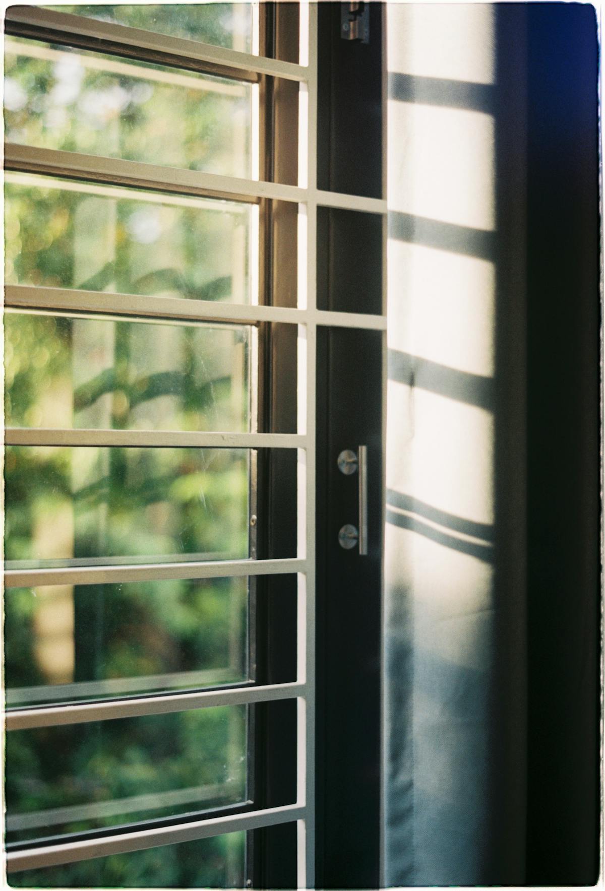 sunlight through window shutters