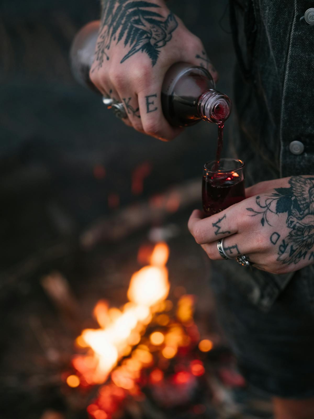 red drink pouring into glass